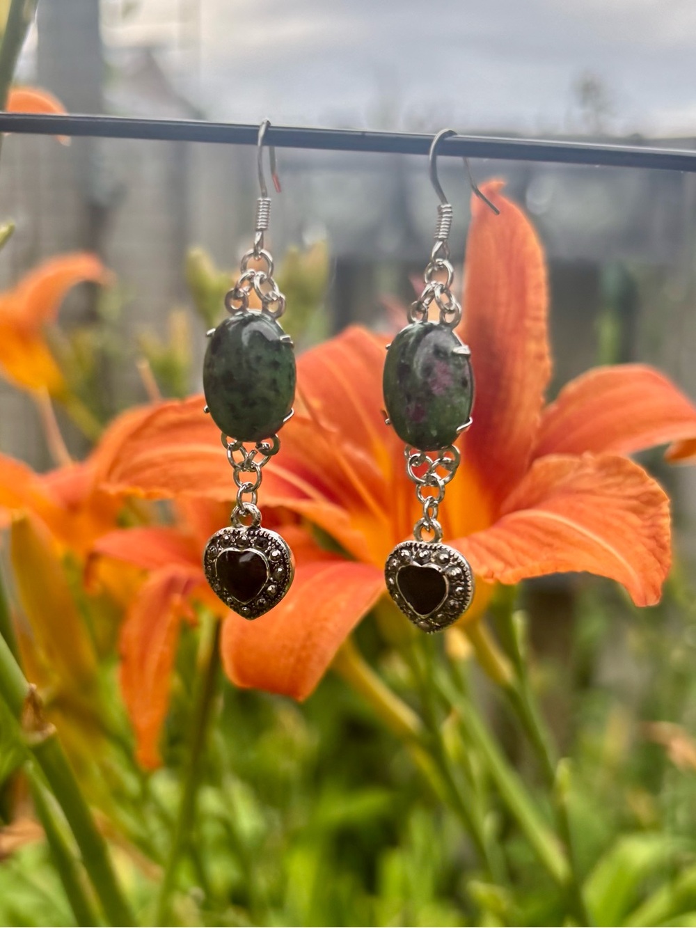 Ruby zoisite dangle earrings.